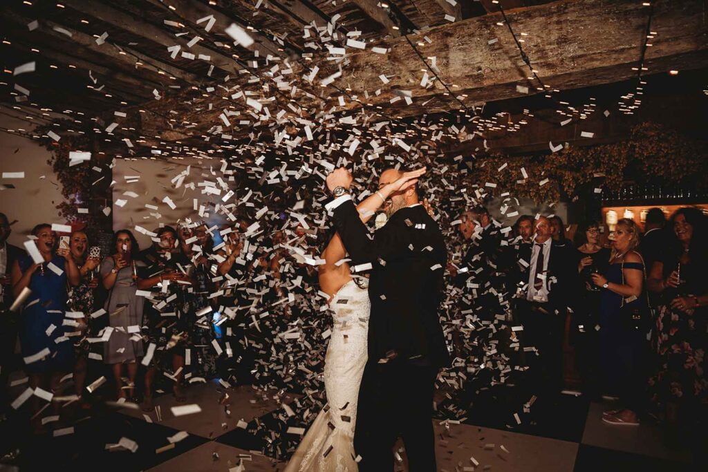 A couple are showed in confetti on the dance floor at Bilsington Priory, near Ashford