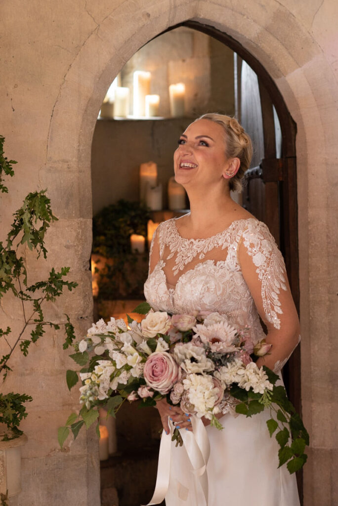 A bride in a pretty wedding dress in Bilsington Priory