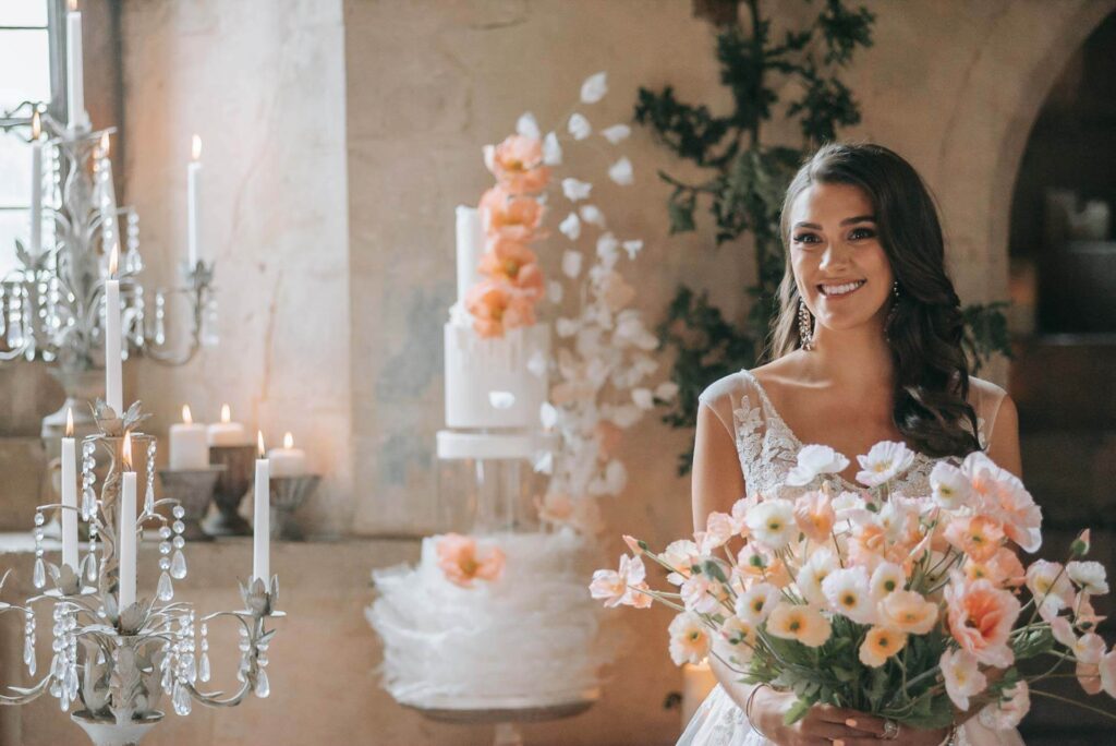 A bride stands inside the Great Hall of Bilsington Priory