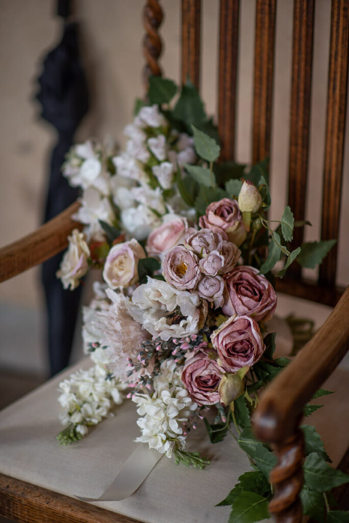 A bouquet on a chair in the Bilsington Priory near Ashford, Kent