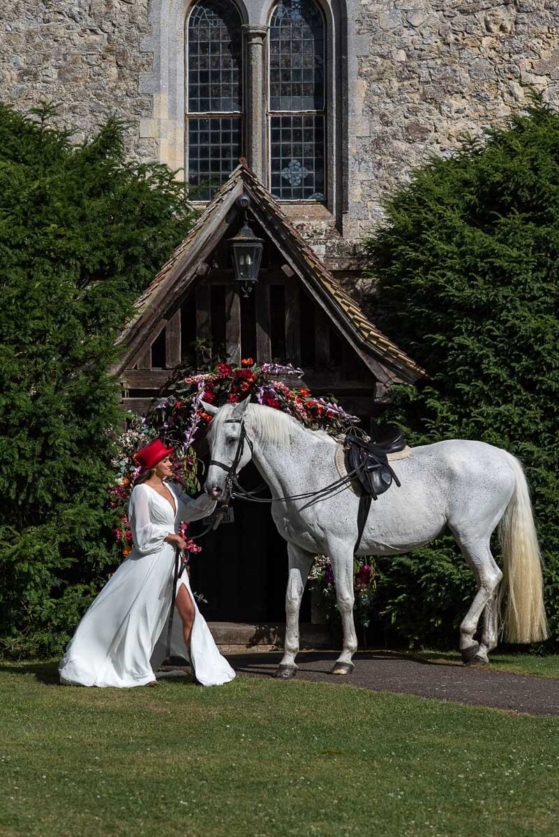 A bride outside the porch of the Bilsington Priory