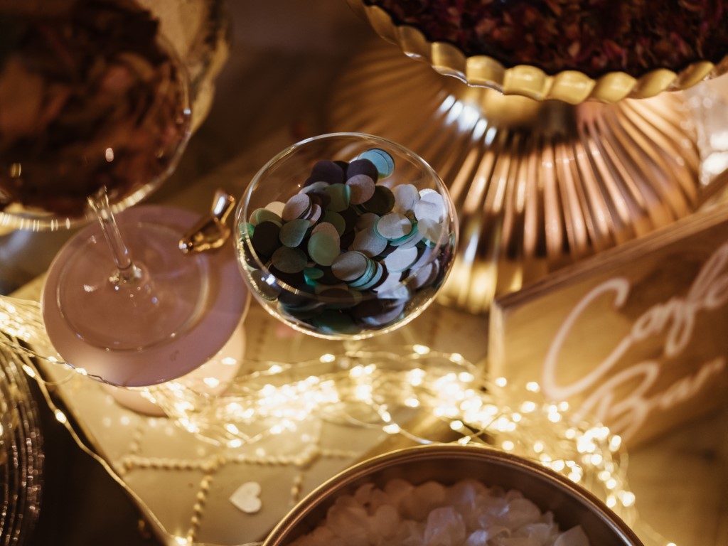 Paper confetti in a champagne flute on a confetti bar at Bilsington Priory wedding venue in Kent
